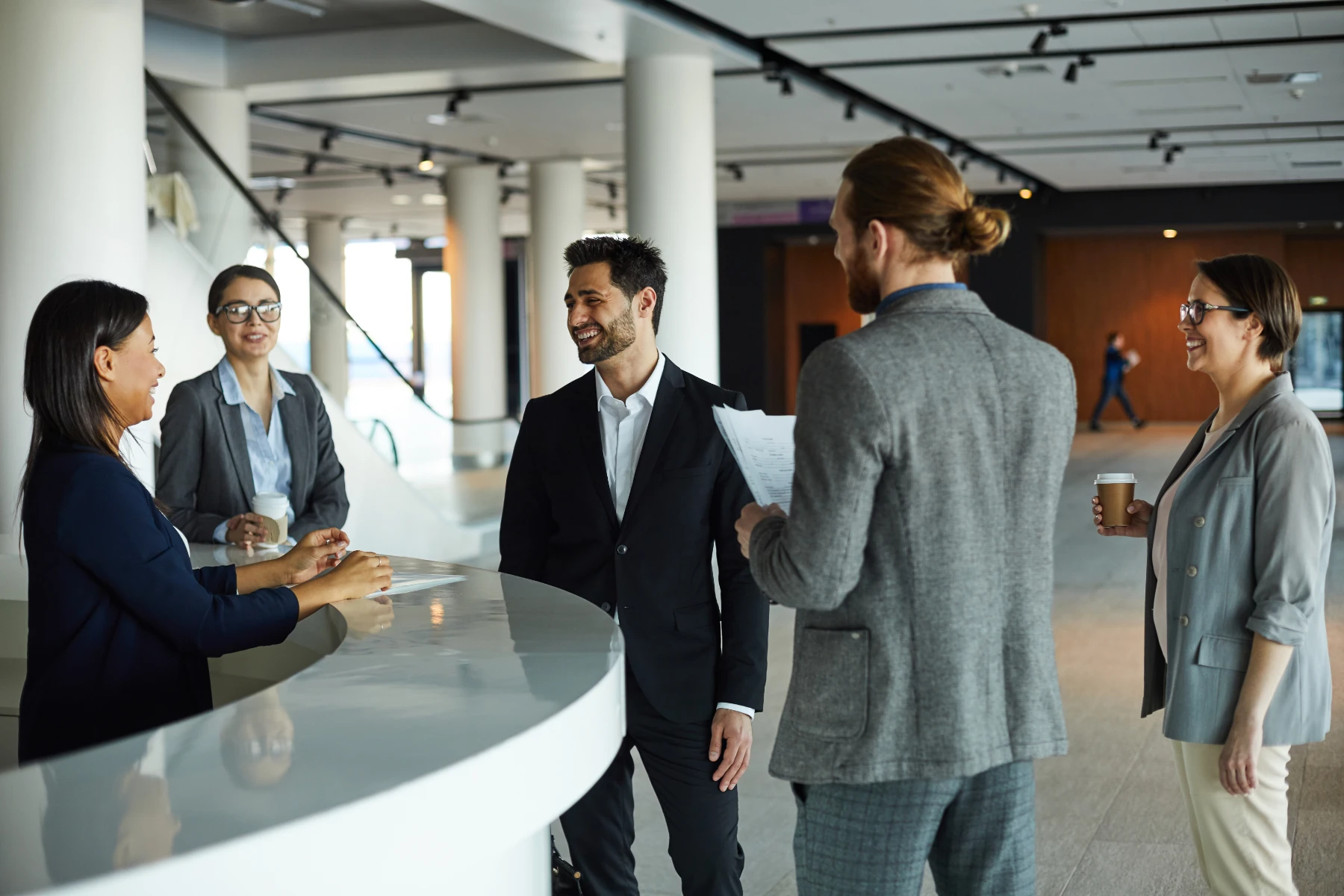 Business People Meeting in Modern Office Lobby